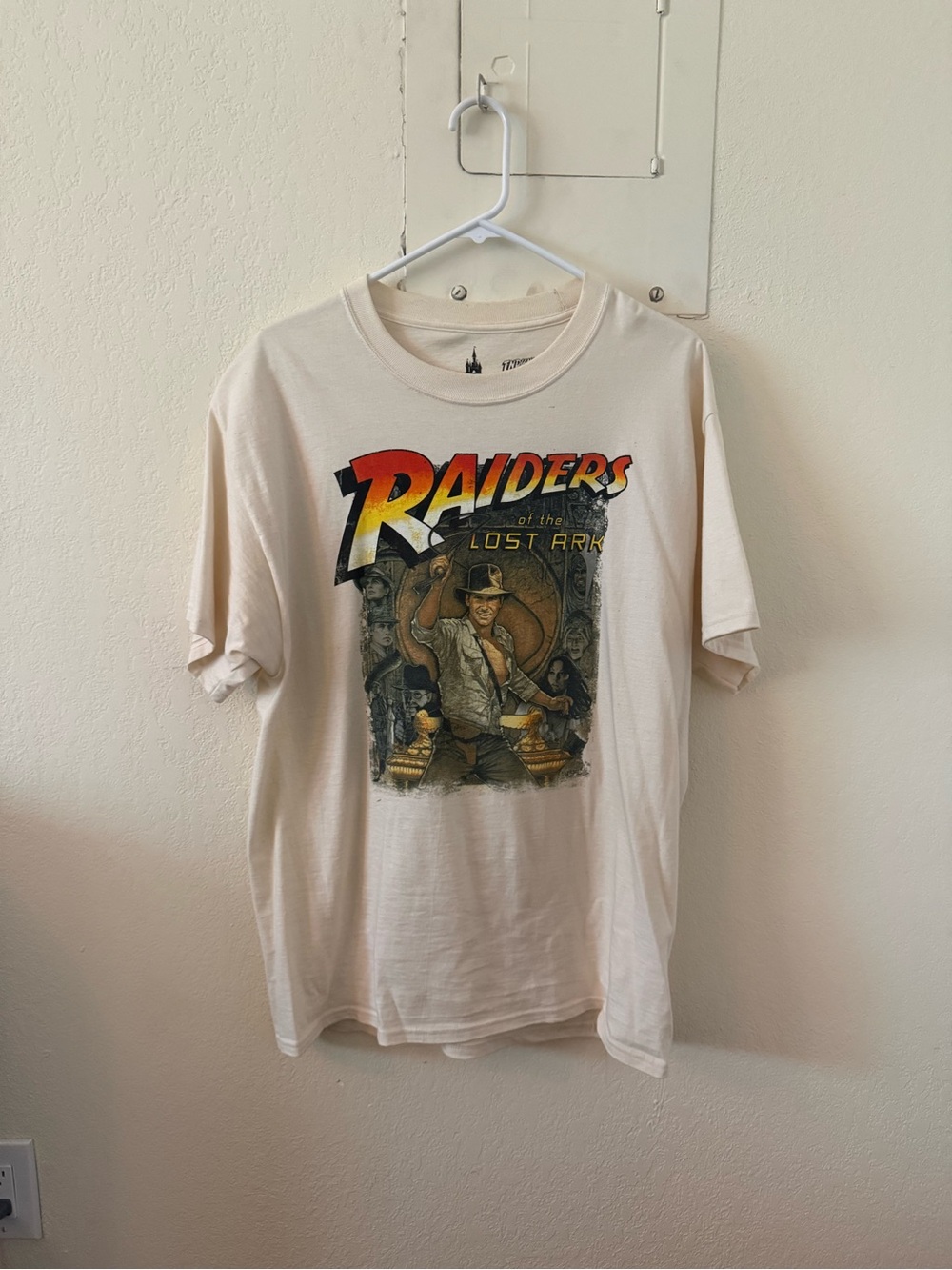 Disney Raiders of the Lost Ark Graphic Tee - Cream with Red/Yellow Logo